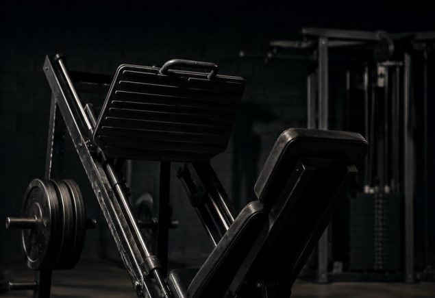 Leg press machine in a quiet gym, set up for a beginner machines-only leg day