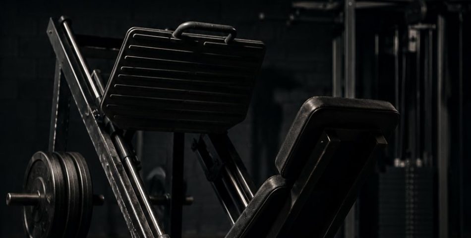 Leg press machine in a quiet gym, set up for a beginner machines-only leg day