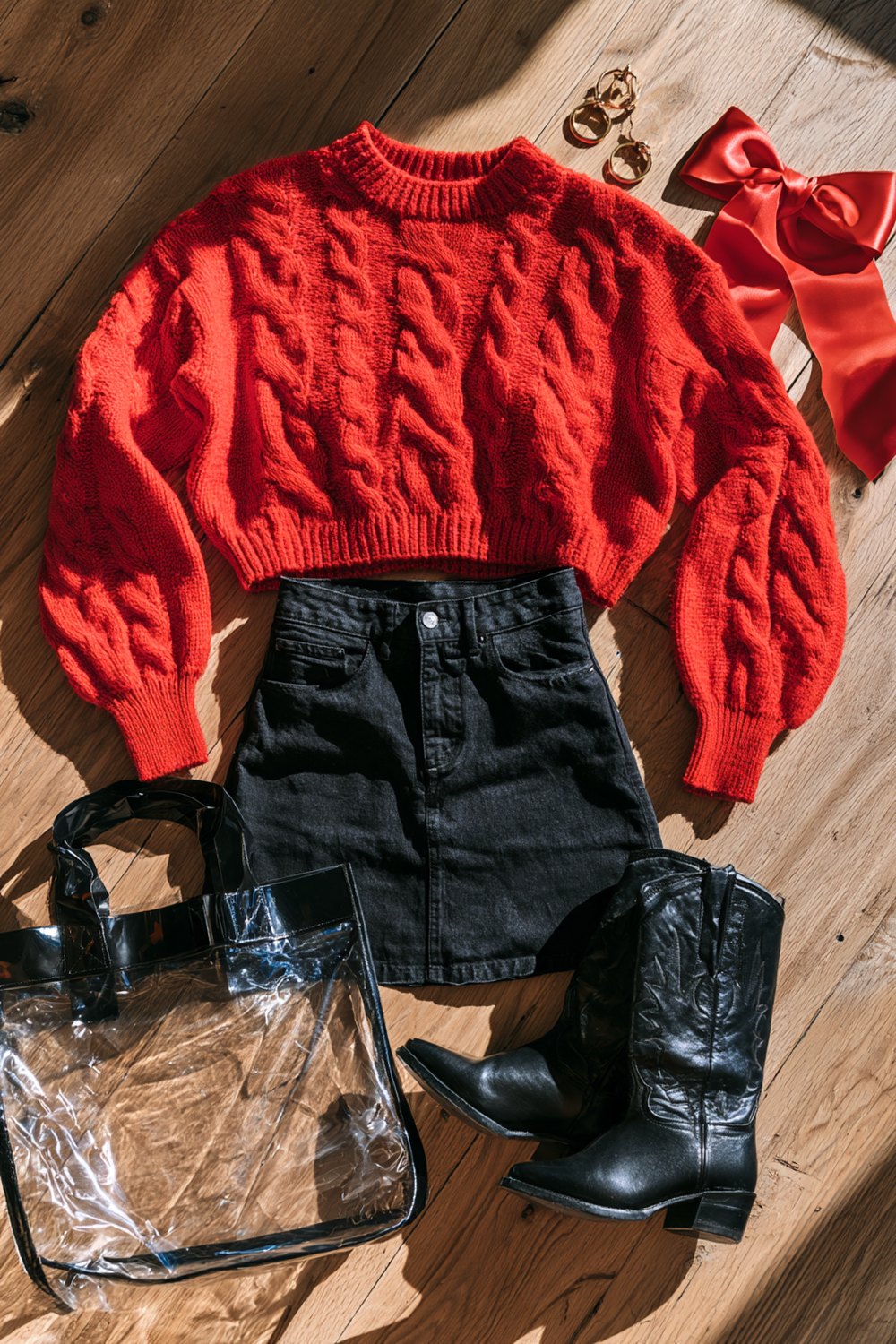 Cute Georgia game day look laid out: red knit sweater, black denim mini skirt, black boots and gold hoops