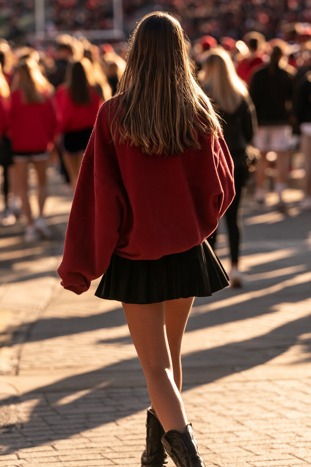 Red and black game day outfit seen from behind on a sunny fall afternoon outside the stadium