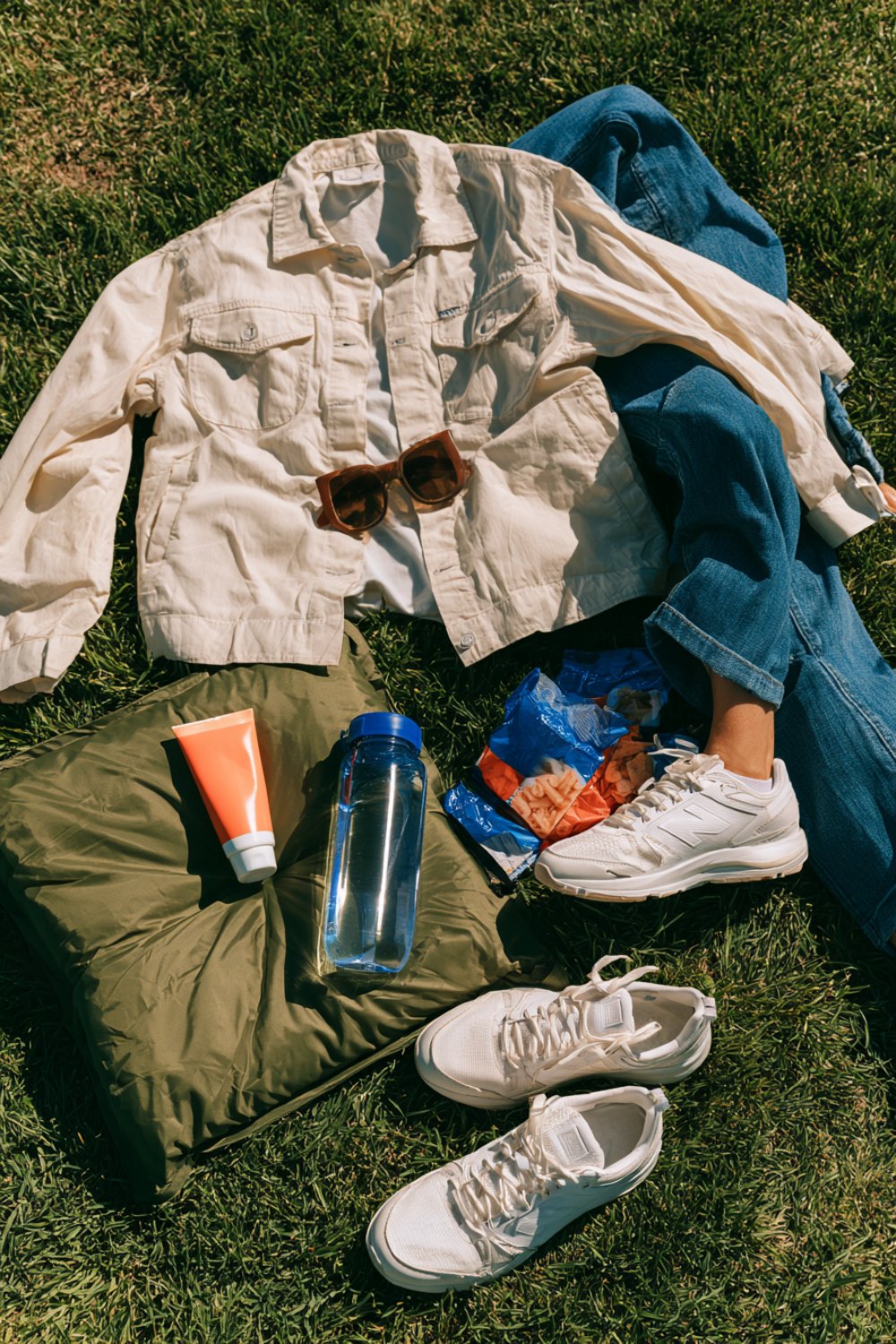 Light jacket, jeans, white sneakers and snacks laid out for a long track meet